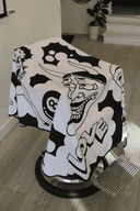 close up of Love Hate Barber Cutting cape draped onb barber chair